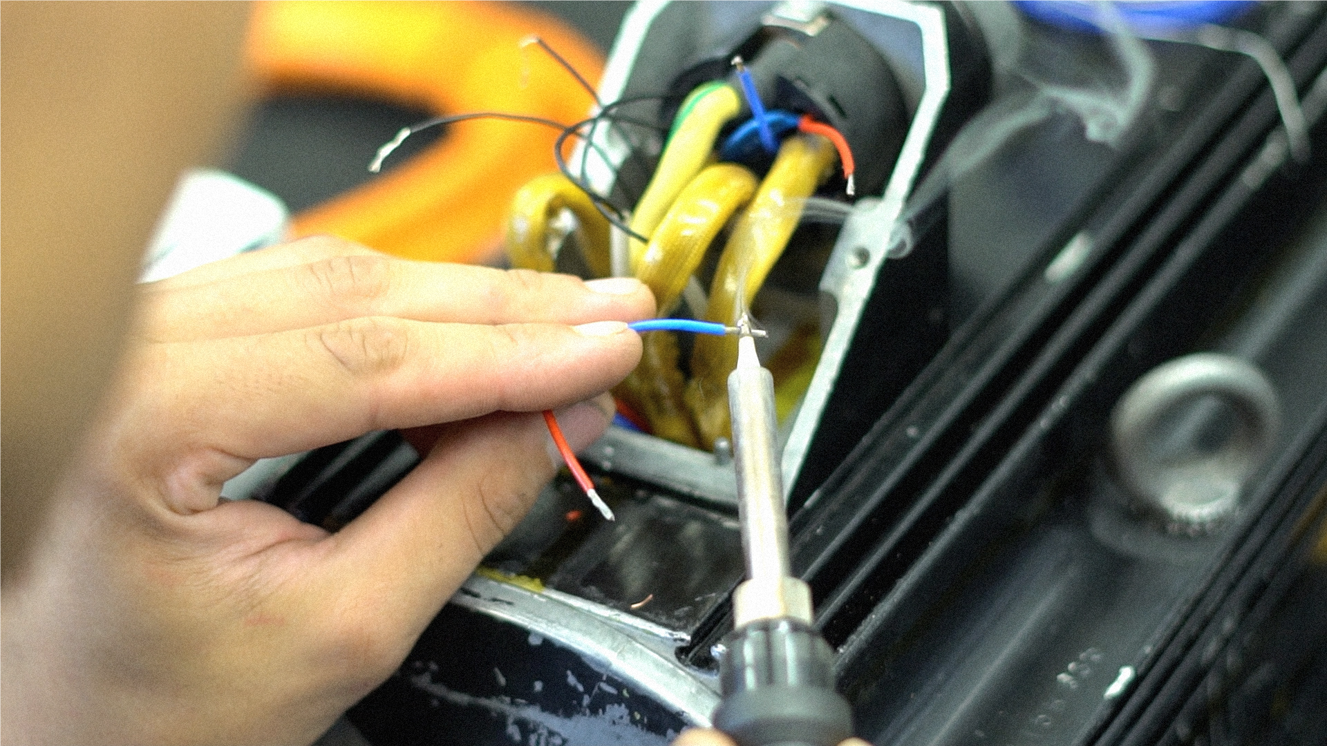 Service technician repairs Indramat motor at Neethsel HK
